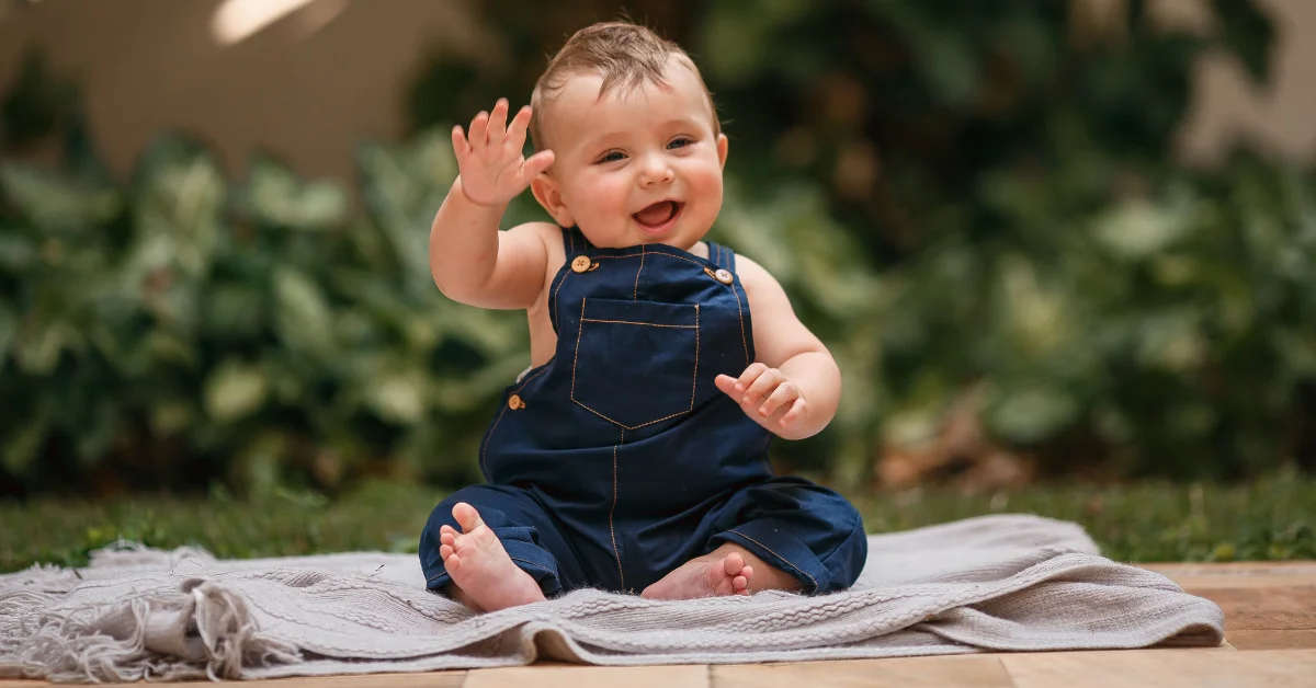 when do babies learn to wave
