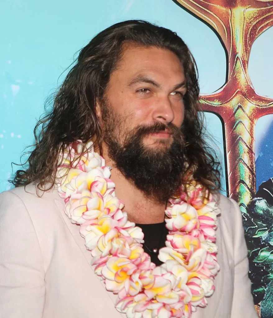 Jason Momoa wearing Hawaiian lei at Aquaman premiere