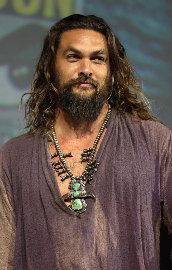 Jason Momoa wearing turquoise necklace at event