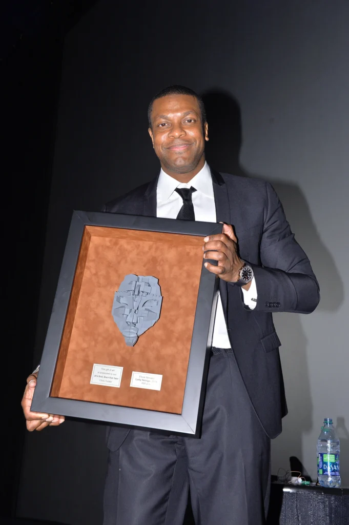 Chris Tucker in tuxedo at formal event