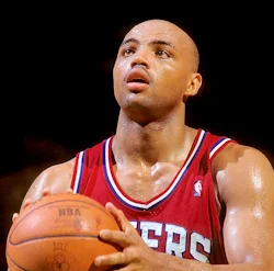 Charles Barkley in Philadelphia 76ers jersey holding basketball