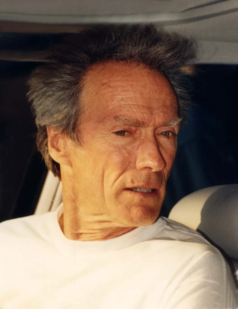 Clint Eastwood candid portrait in white shirt during filmmaking career