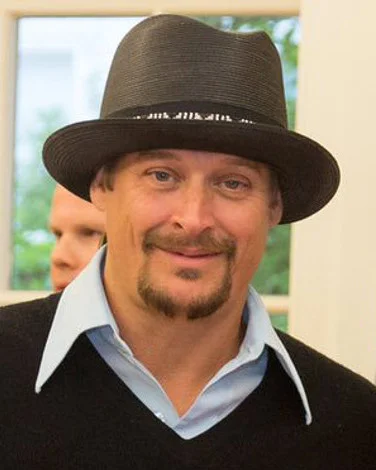 Kid Rock wearing black fedora hat and sweater