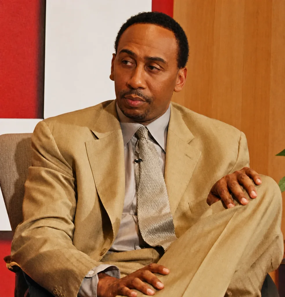 Stephen A. Smith in a tan suit during an early career television interview