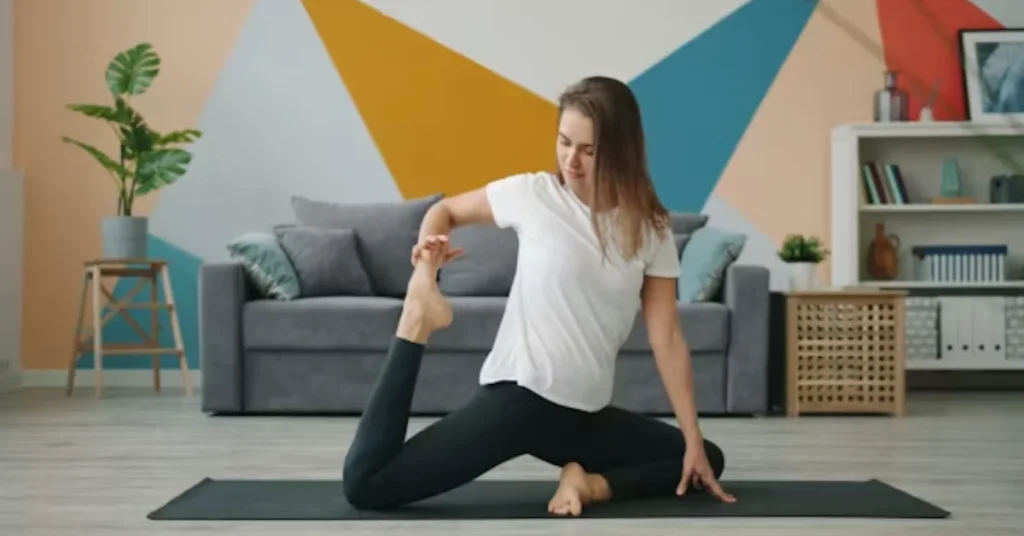 Woman doing a brief morning stretching routine on a yoga mat in her living room
