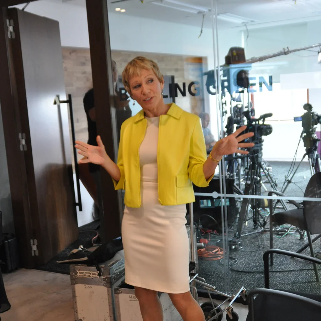 Barbara Corcoran speaking at media event in yellow blazer
