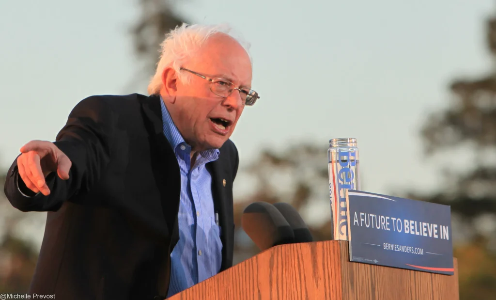Bernie Sanders speaking at campaign rally podium