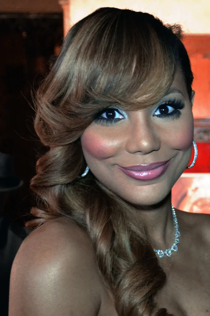 Tamar Braxton portrait wearing diamond jewelry and styled hair
