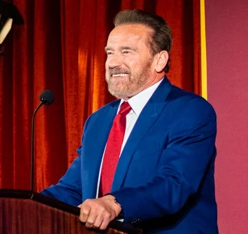 Arnold Schwarzenegger speaking at event 2026