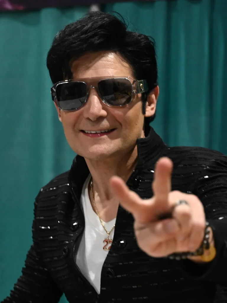Corey Feldman making peace sign at fan convention 2026