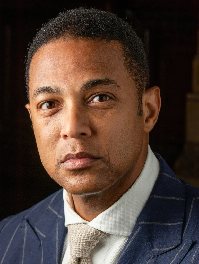 Don Lemon in navy pinstripe suit, CNN anchor and journalist