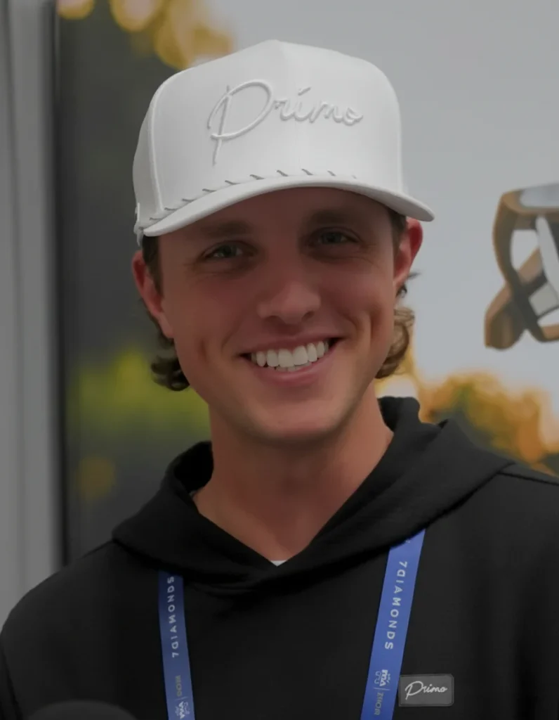 Grant Horvat wearing Primo cap and 71 Diamonds lanyard at golf event 2026