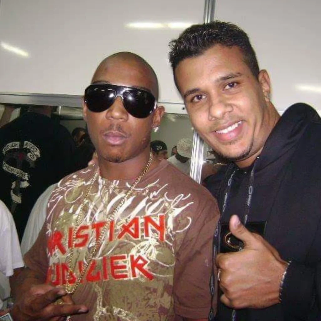 Ja Rule wearing sunglasses and Christian Audigier shirt backstage during Murder Inc. era